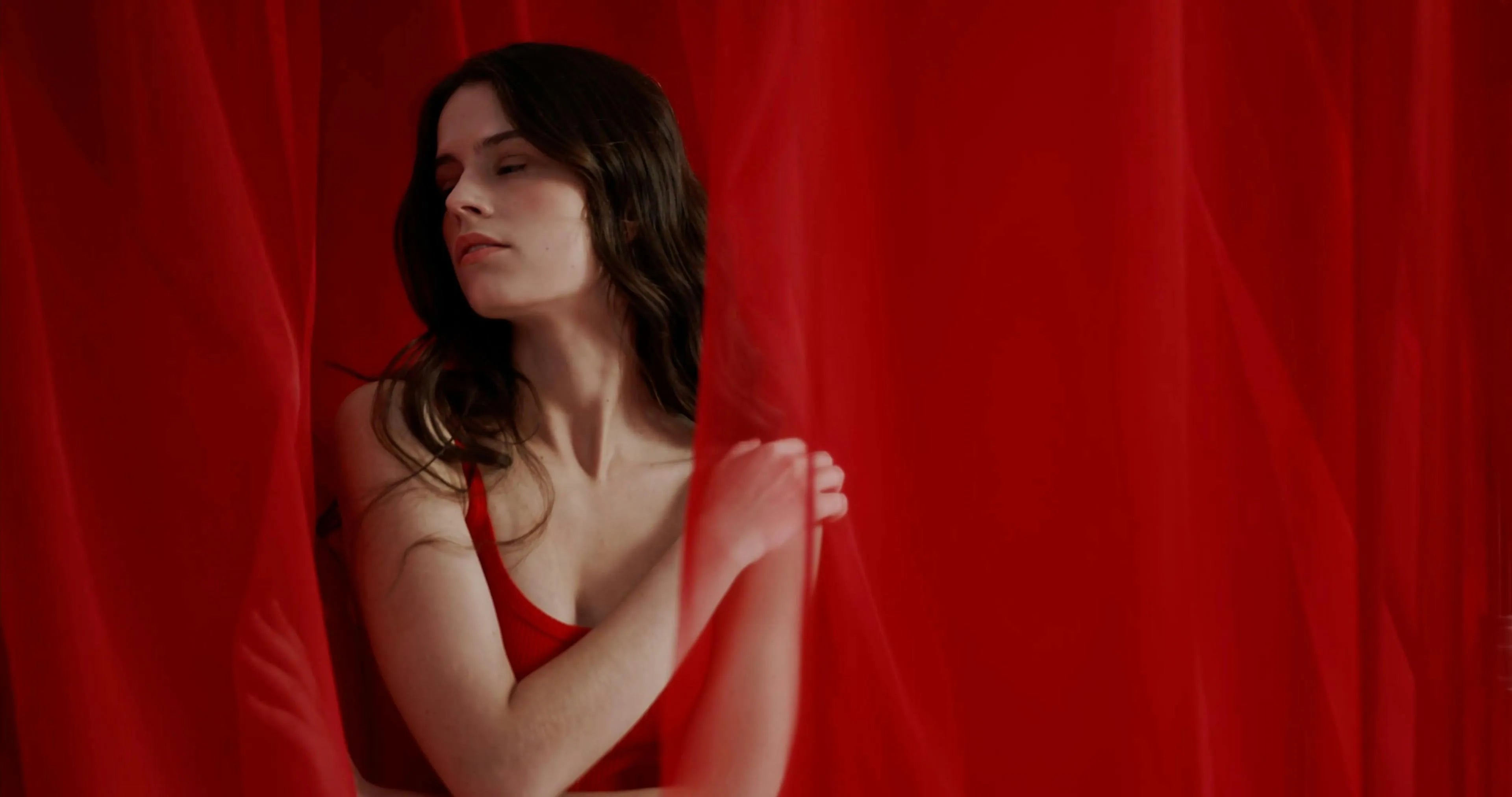 a woman in red curtain