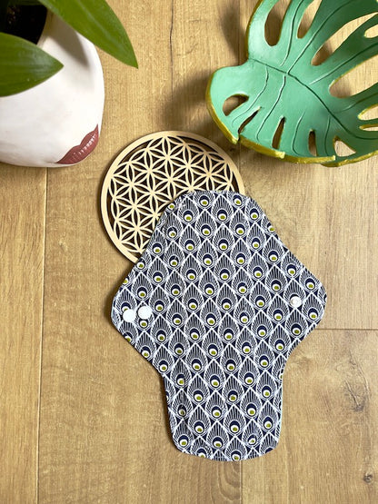 Heavy flow or night time sanitary napkin