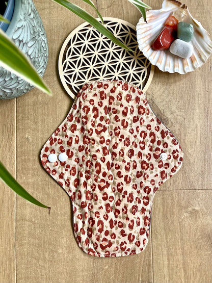 Heavy flow or night time sanitary napkin