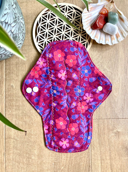 Heavy flow or night time sanitary napkin