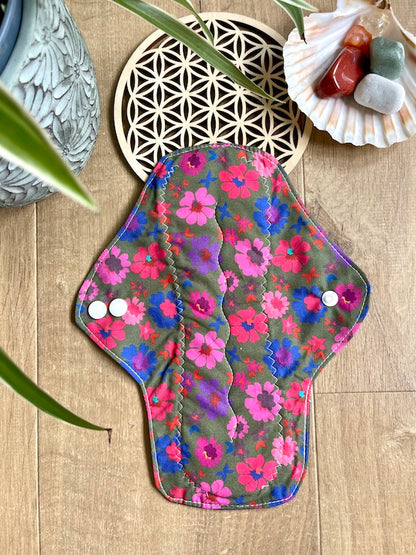 Heavy flow or night time sanitary napkin