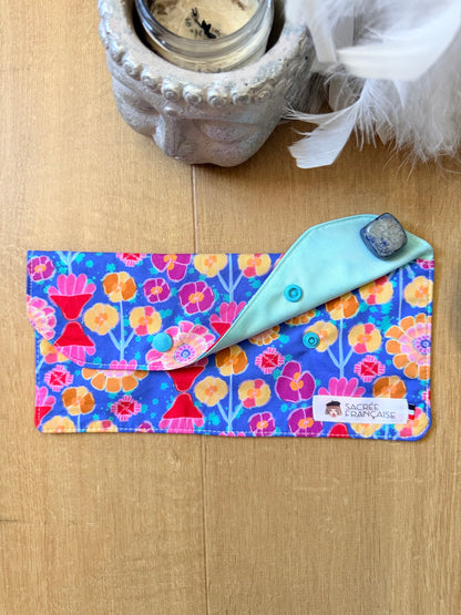 Pochette imperméable Taille L fleur multicolore fond bleu