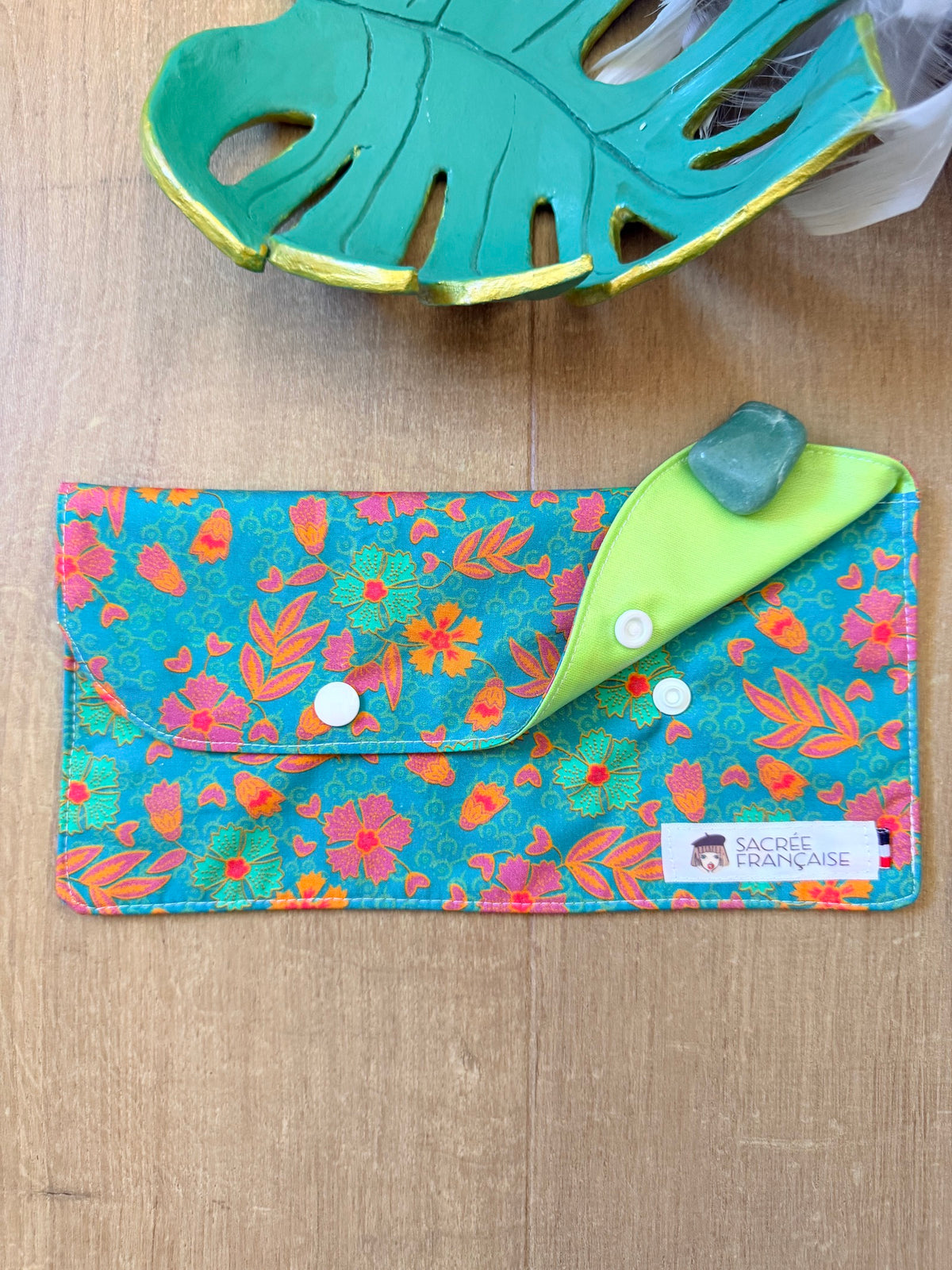 Pochette imperméable taille M fleur oranger fond vert