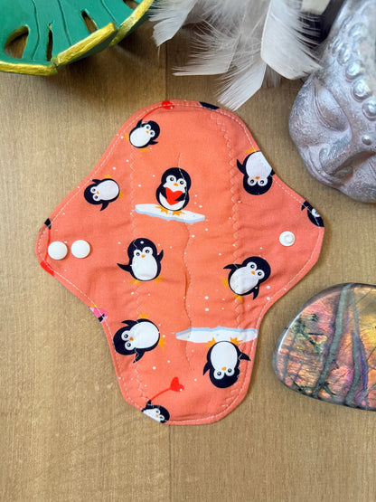 Serviette flux moyen pingouin fond corail